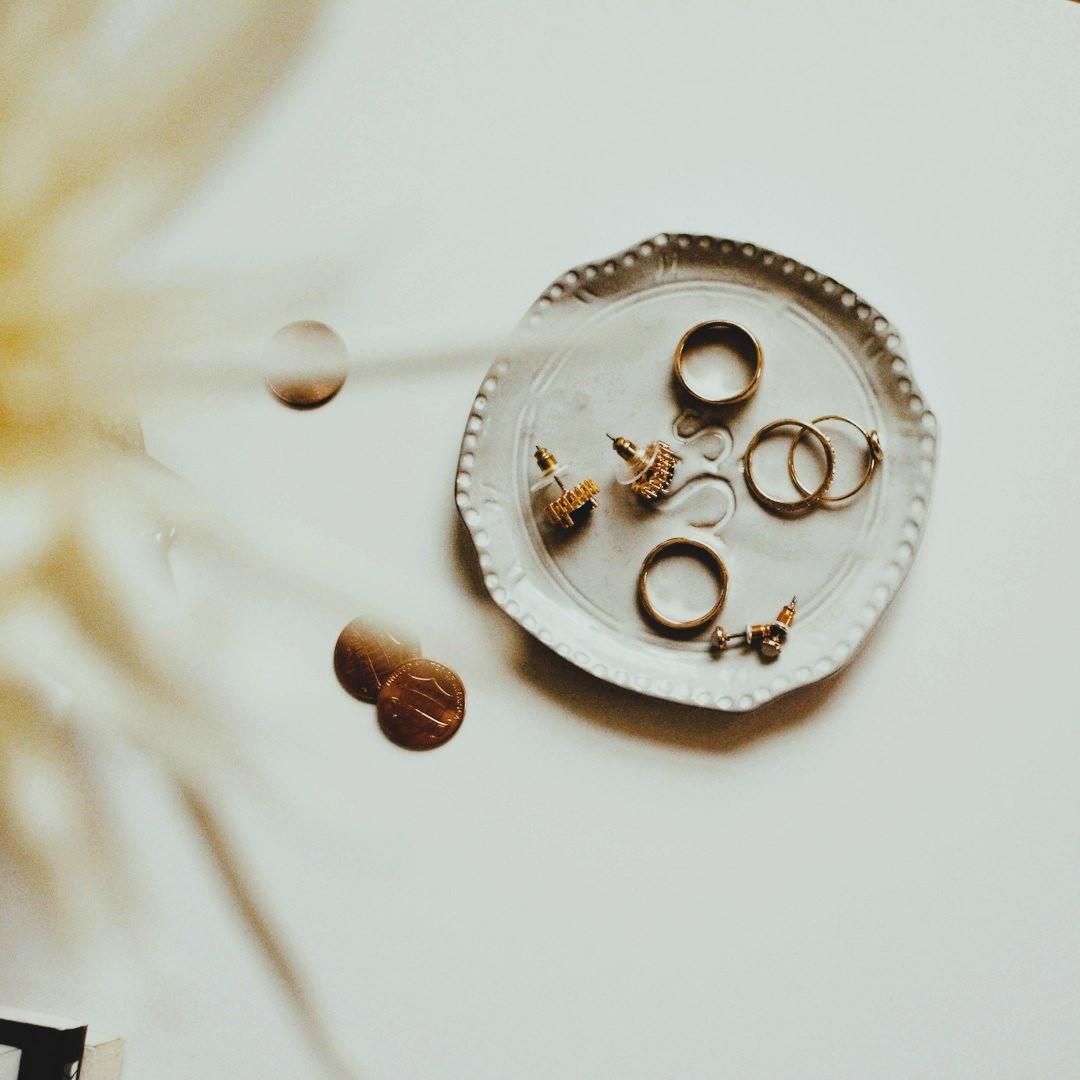 Miradorr ethics — gold jewelry collection on tray